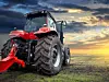 Agricultural tractor working in the field at sunset background