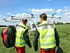 Team der ADAC Luftrettung vor einem Multicopter von Volocopter