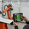 Die neue AR-Software von Kuka visualisiert die Umgebung von Roboterzellen live auf dem Smartphone.