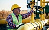 Worker checking valves on the fuel supply systems. Concept of industry